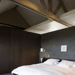 Chambre sous les toits avec sa charpente apparente