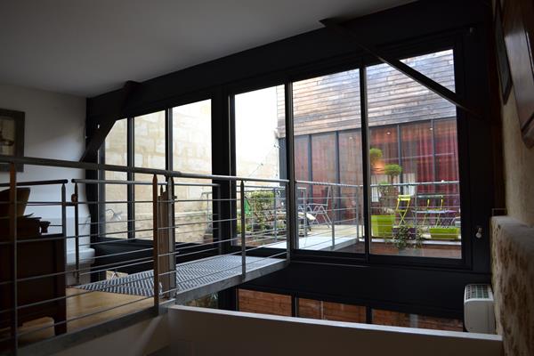 Image Passerelle depuis séjour au dessus cuisine Cabinet d'architecture Agnès Barokel